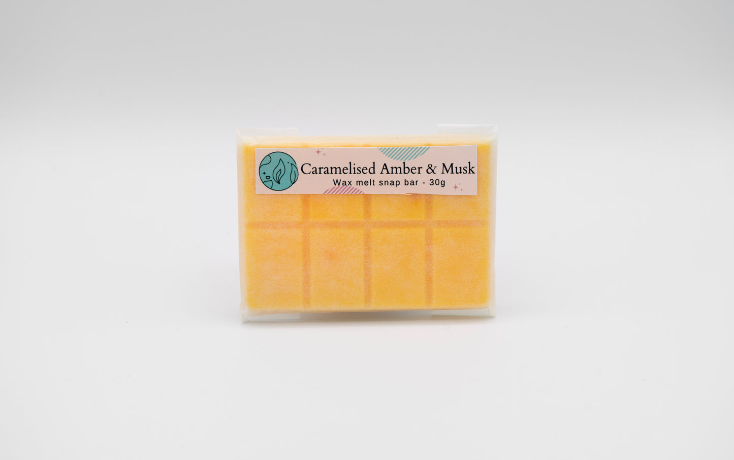 caramelised amber and musk 30g or 90g strongly scented wax melt snap bars. Eco friendly waxed paper packaging. Brighton Rock Workshop wax melts made in Spain and the United Kingdom, available in two sizes. Suitable for tea light or electric burners