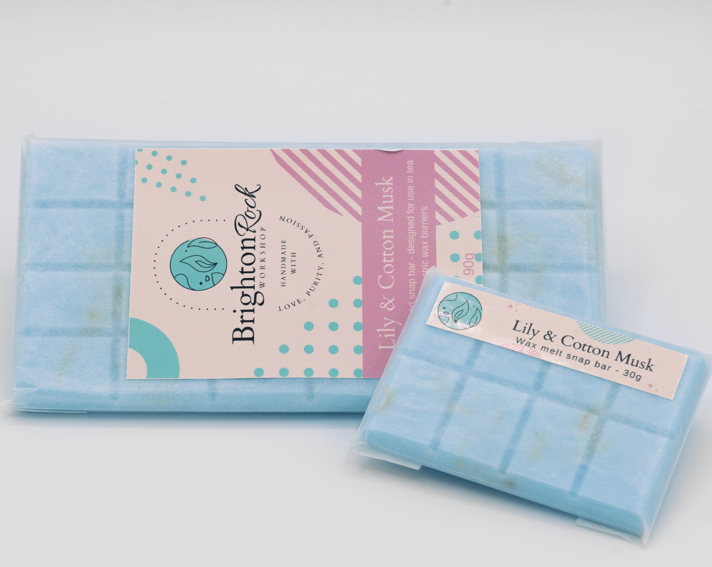 Delicate Lily and cotton musk fragranced 30g or 90g strongly scented wax melt snap bars. Eco friendly waxed paper packaging. Brighton Rock Workshop wax melts made in Spain and the United Kingdom, available in two sizes. Suitable for tea light or electric burners
