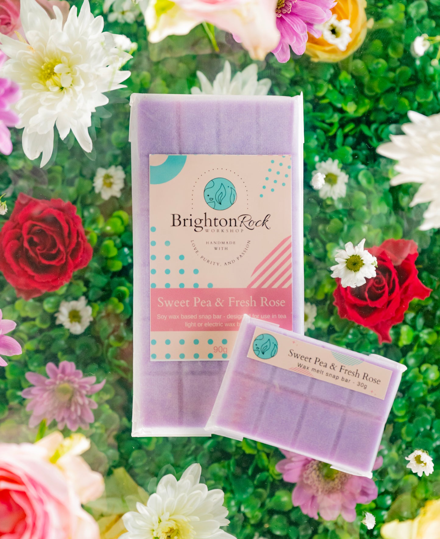sweet pea and fresh rose scented purple 30g or 90g strongly scented wax melt snap bars. Eco friendly waxed paper packaging. Brighton Rock Workshop wax melts made in Spain and the United Kingdom, available in two sizes. Suitable for tea light or electric burners