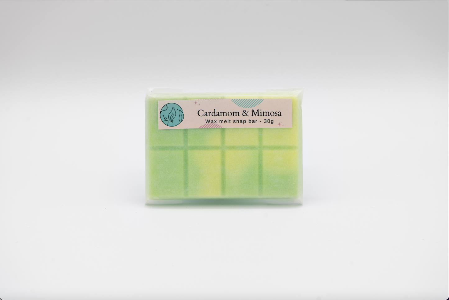 cardamom and mimosa 30g or 90g strongly scented wax melt snap bars. Eco friendly waxed paper packaging. Brighton Rock Workshop wax melts made in Spain and the United Kingdom, available in two sizes. Suitable for tea light or electric burners