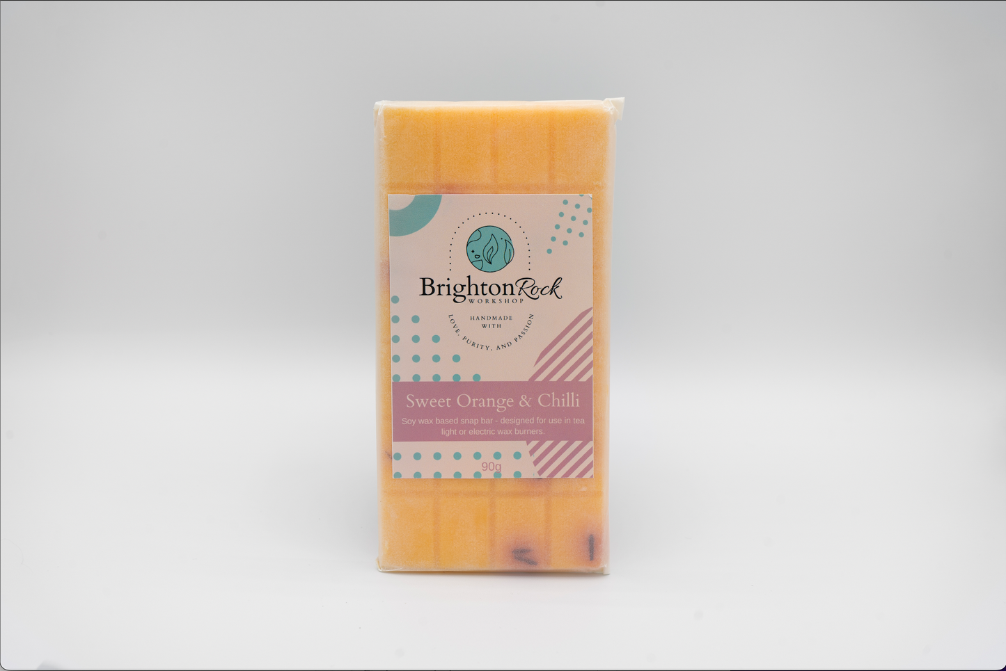 sweet orange & chilli pepper scented 30g or 90g strongly scented wax melt snap bars. Eco friendly waxed paper packaging. Brighton Rock Workshop wax melts made in Spain and the United Kingdom, available in two sizes. Suitable for tea light or electric burners