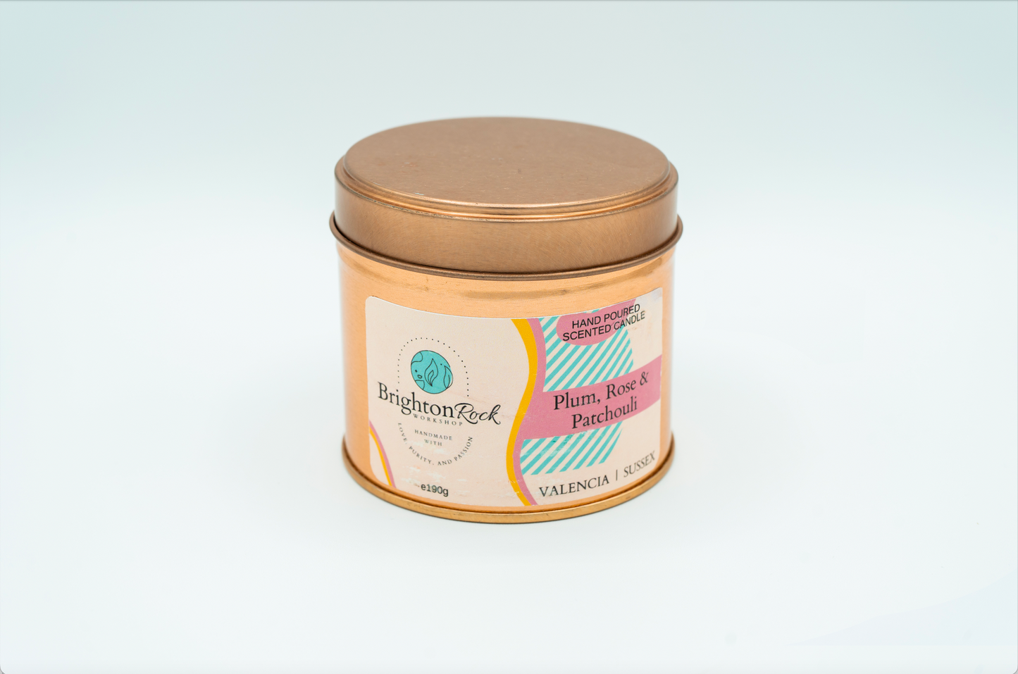 plum, rose & patchouli scented candle in a rose gold tin with matching lid. Brighton Rock Workshop strongly-scented candles. 190g eco-friendly, sustainable, recyclable packaging, vegan friendly and cruelty free