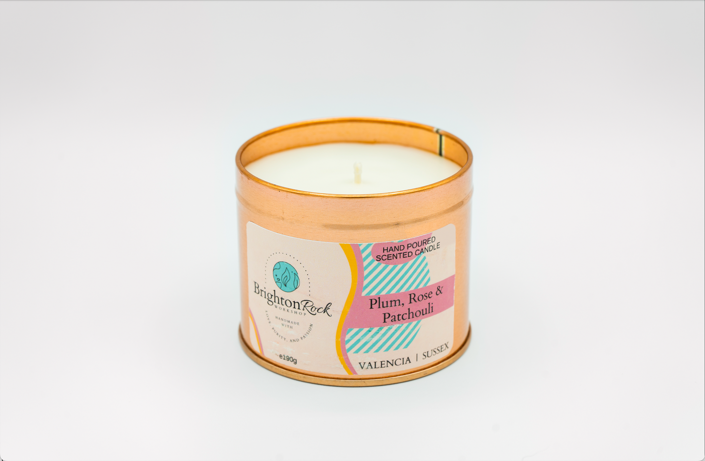 plum, rose & patchouli scented candle in a rose gold tin with matching lid. Brighton Rock Workshop strongly-scented candles. 190g eco-friendly, sustainable, recyclable packaging, vegan friendly and cruelty free