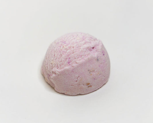 chamomile lavender & vanilla bath truffle in a warm bubbly bath, handmade in brighton skincare bath & body warm scent bath bomb shea butter vegan