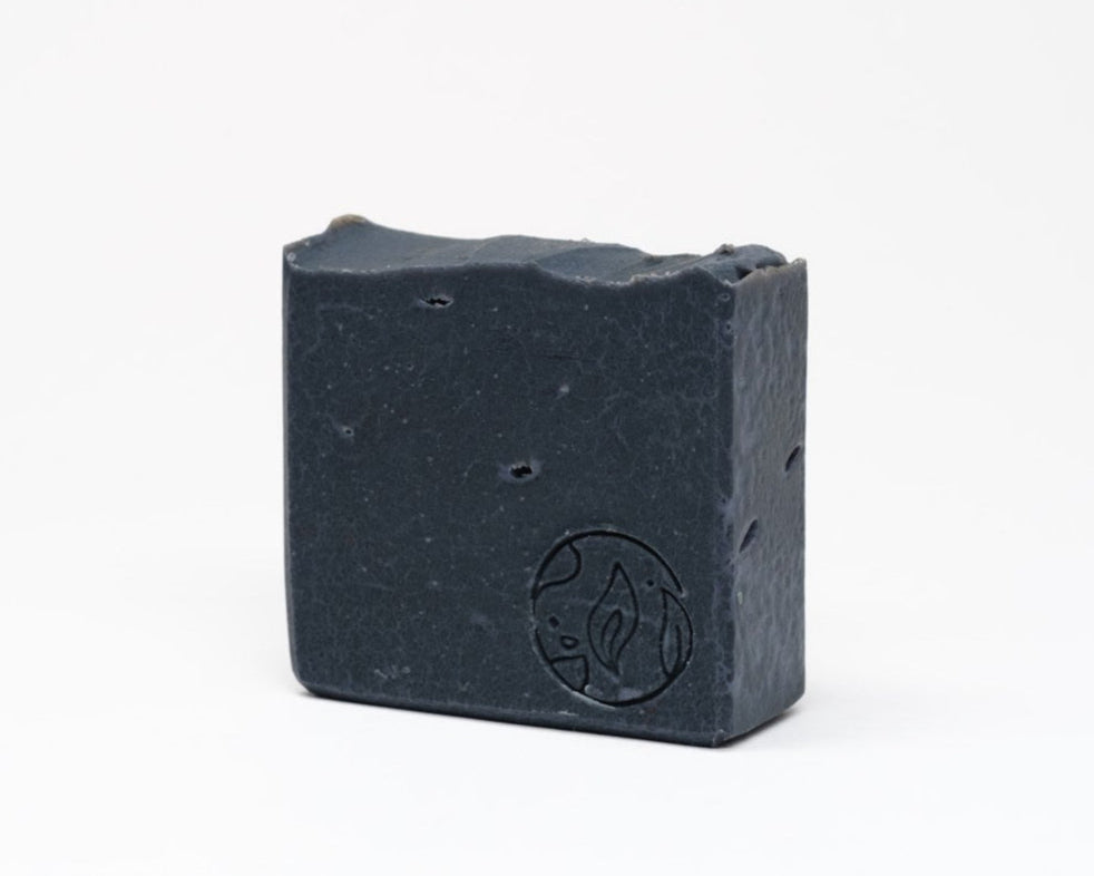 smokey citrus and rum activated charcoal soap made with shea butter. gifts for men. gifts for fathers day.