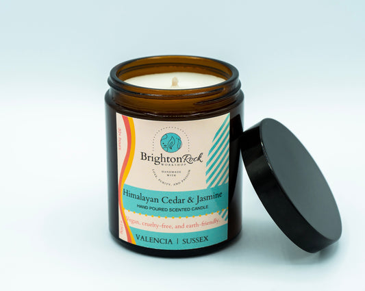 Brighton Rock Workshop Himalayan Cedar & Jasmine scented candle in amber glass jar with black lid. 150g hand poured and handcrafted with love, purity, and passion in Alicante, Spain. Eco-friendly and recyclable, vegan friendly and cruelty free. You are donating to Fripps Farm animal rescue with every purchase.