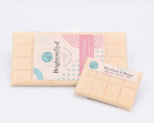 Thai peach and mango scented 30g or 90g strongly scented wax melt snap bars. Eco friendly waxed paper packaging. Brighton Rock Workshop wax melts made in Spain and the United Kingdom, available in two sizes. Suitable for tea light or electric burners