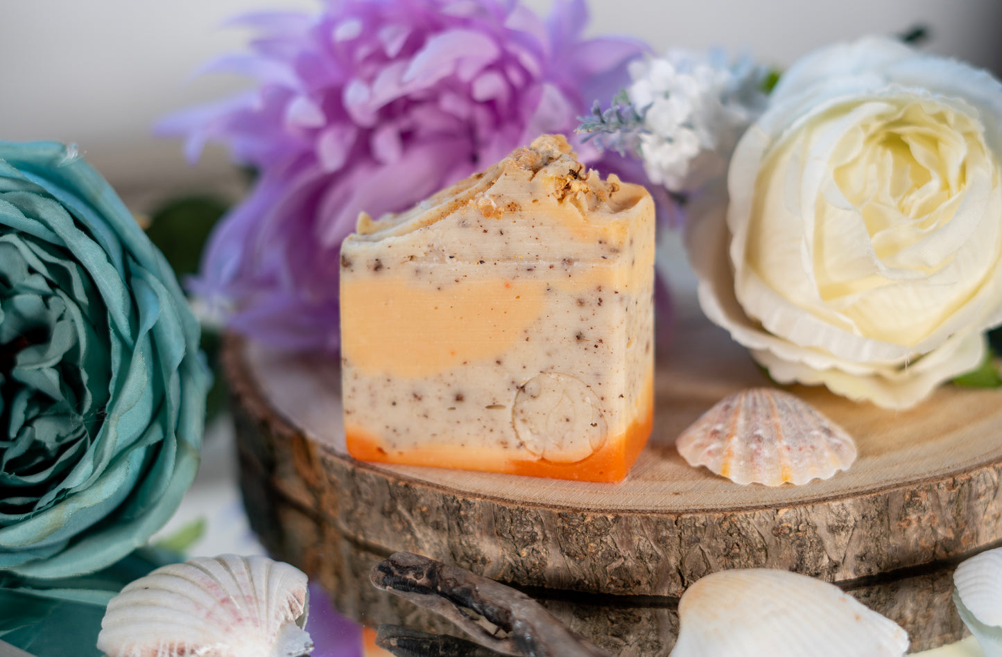 Handmade orange & coconut scented bar soap made from nourishing butters and oils. shea butter, olive oil, coconut oil and real coconut fibres exfoliating soap. eco friendly and sustainable. vegan friendly and cruelty free.