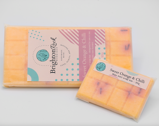 sweet orange & chilli pepper scented 30g or 90g strongly scented wax melt snap bars. Eco friendly waxed paper packaging. Brighton Rock Workshop wax melts made in Spain and the United Kingdom, available in two sizes. Suitable for tea light or electric burners