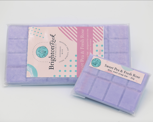 sweet pea and fresh rose scented purple 30g or 90g strongly scented wax melt snap bars. Eco friendly waxed paper packaging. Brighton Rock Workshop wax melts made in Spain and the United Kingdom, available in two sizes. Suitable for tea light or electric burners