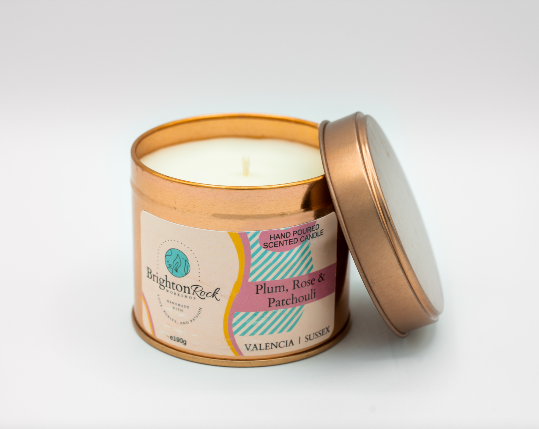 plum, rose & patchouli scented candle in a rose gold tin with matching lid. Brighton Rock Workshop strongly-scented candles. 190g eco-friendly, sustainable, recyclable packaging, vegan friendly and cruelty free