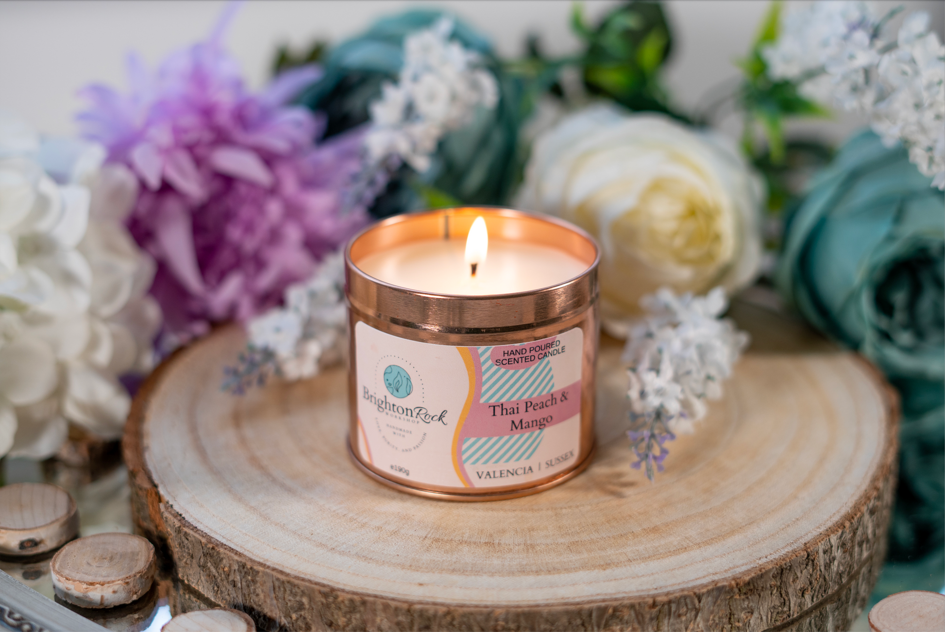 thai peach, mango, and citrus scented candle in a rose gold tin with matching lid. Brighton Rock Workshop strongly-scented candles. 190g eco-friendly, sustainable, recyclable packaging, vegan friendly and cruelty free
